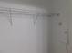 This image features a closet with a simple wire shelf and bracket storage system at 330 La Perla Dr, Sugar Hill, GA 30518