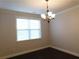 Dining room with hardwood floors and natural light from the window at 330 La Perla Dr, Sugar Hill, GA 30518