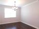 Dining room with hardwood floors and natural light from the window at 330 La Perla Dr, Sugar Hill, GA 30518