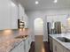 Kitchen showcases stainless steel appliances, white cabinets, and granite countertops at 330 La Perla Dr, Sugar Hill, GA 30518