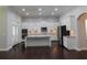 Bright kitchen with white cabinets, granite countertops, and stainless steel appliances at 330 La Perla Dr, Sugar Hill, GA 30518