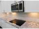 Close up of a kitchen appliance showing a stainless steel cook top at 330 La Perla Dr, Sugar Hill, GA 30518