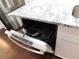 Kitchen appliance shot of a dishwasher next to a granite countertop at 330 La Perla Dr, Sugar Hill, GA 30518