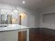 Open kitchen featuring stainless steel appliances, granite countertops, and island with sink at 330 La Perla Dr, Sugar Hill, GA 30518