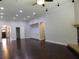 Spacious living room with recessed lighting, dark hardwood floors and fireplace at 330 La Perla Dr, Sugar Hill, GA 30518