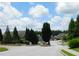 Street view showing well-maintained homes, manicured lawns, mature trees, and attractive landscaping at 330 La Perla Dr, Sugar Hill, GA 30518