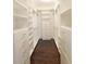 Spacious walk-in closet with custom shelving and drawers at 330 La Perla Dr, Sugar Hill, GA 30518