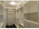 Spacious walk-in closet with custom built-in shelving and drawers, maximizing storage space at 330 La Perla Dr, Sugar Hill, GA 30518