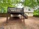 Elevated wooden back deck perfect for outdoor entertaining, overlooking a private backyard at 48 Glenhaven Ct, Douglasville, GA 30134