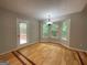 Bright dining area featuring a bay window with views of the green backyard and access to the deck at 48 Glenhaven Ct, Douglasville, GA 30134