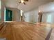 Bright and airy living room with hardwood floors, a vaulted ceiling, and an attractive front door at 48 Glenhaven Ct, Douglasville, GA 30134