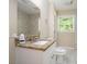Bathroom featuring granite vanity, toilet, and tiled shower with neutral paint at 1534 Sw Austin Sw Rd, Atlanta, GA 30331