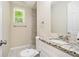 Updated bathroom featuring granite countertop, white vanity, and tiled walk-in shower at 1534 Sw Austin Sw Rd, Atlanta, GA 30331
