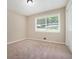 Well-lit bedroom with carpet floors, closet and large window, offering a calming space at 1534 Sw Austin Sw Rd, Atlanta, GA 30331