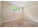 Cozy bedroom with neutral walls, carpet floors and large window, offering a tranquil retreat at 1534 Sw Austin Sw Rd, Atlanta, GA 30331