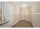 Charming kitchen nook area with modern wood floors, lots of light and traditional paneled walls at 1534 Sw Austin Sw Rd, Atlanta, GA 30331
