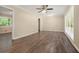 Bright living room with wood-look flooring and natural light from large windows, offering ample space at 1534 Sw Austin Sw Rd, Atlanta, GA 30331