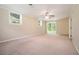 Spacious living room with large sliding glass doors, neutral walls and plush carpeting at 1534 Sw Austin Sw Rd, Atlanta, GA 30331