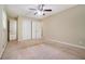 Spacious main bedroom with closet doors, neutral walls, carpet floors and connected bath at 1534 Sw Austin Sw Rd, Atlanta, GA 30331