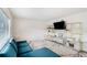 Bright and airy living room with comfortable seating and modern shelving at 1705 Monroe Ne Dr # E3, Atlanta, GA 30324