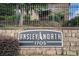 A sign for Ansley North 1705 with a stone brick wall and black iron fence at 1705 Monroe Ne Dr # E3, Atlanta, GA 30324