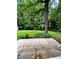 A view of the backyard with lots of trees and a detached garage in the background at 287 Willow Cove Ct, Lawrenceville, GA 30044