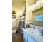 Bright bathroom featuring a shower with white and gray striped curtain and ample counter space at 287 Willow Cove Ct, Lawrenceville, GA 30044