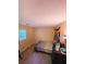 Bedroom featuring a bed, carpeted floor, and a window for natural light at 287 Willow Cove Ct, Lawrenceville, GA 30044