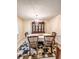 Dining room features a chandelier over a table and matching chairs at 287 Willow Cove Ct, Lawrenceville, GA 30044