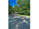 Charming home featuring a well-manicured lawn and mature trees providing ample shade at 287 Willow Cove Ct, Lawrenceville, GA 30044