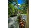 A view of the front yard, showcasing trees, landscaping, and a charming exterior, offering a welcoming entrance to the home at 287 Willow Cove Ct, Lawrenceville, GA 30044