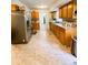 Spacious kitchen featuring ample cabinetry, stainless steel refrigerator and tile flooring at 287 Willow Cove Ct, Lawrenceville, GA 30044
