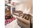 Comfortable living room features patterned rug, and brick fireplace at 287 Willow Cove Ct, Lawrenceville, GA 30044