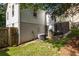 View of the backyard with exterior access and featuring AC unit and gated area at 3158 Granby Ave, Scottdale, GA 30079