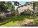 A roomy backyard featuring a storage shed and lush greenery that offers ample space for outdoor activities at 3158 Granby Ave, Scottdale, GA 30079