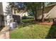 View of a backyard with green grass and a variety of trees at 3158 Granby Ave, Scottdale, GA 30079