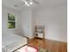Bedroom with Hardwood flooring, natural light, and a play kitchen at 3158 Granby Ave, Scottdale, GA 30079