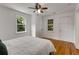 Spacious bedroom with hardwood floors, ceiling fan, closet, and natural light at 3158 Granby Ave, Scottdale, GA 30079