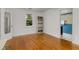 Bedroom featuring hardwood floors and a window overlooking the trees at 3158 Granby Ave, Scottdale, GA 30079
