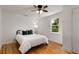 Comfortable bedroom features hardwood floors, ceiling fan, and natural light from the window at 3158 Granby Ave, Scottdale, GA 30079