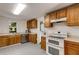 Bright kitchen featuring classic wooden cabinetry and modern appliances; great natural light at 3158 Granby Ave, Scottdale, GA 30079