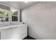 Functional laundry room with washer, dryer, and natural light from the window at 3158 Granby Ave, Scottdale, GA 30079