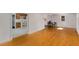 Open-concept living room, hardwood floors, a dining area, and seamless transition to the kitchen at 3158 Granby Ave, Scottdale, GA 30079