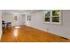 Sun-filled living room with hardwood flooring and large windows offering natural light at 3158 Granby Ave, Scottdale, GA 30079