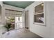 View of a screened porch with an indoor-outdoor feel with a view of a garden area at 3158 Granby Ave, Scottdale, GA 30079