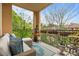 Relaxing balcony with comfortable seating and views of lush greenery and landscaping at 3777 Peachtree Ne Rd # 1227, Brookhaven, GA 30319
