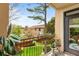 Charming balcony with wrought-iron railing, potted plants, and view of the green community at 3777 Peachtree Ne Rd # 1227, Brookhaven, GA 30319
