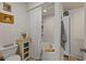 Cozy bathroom featuring a shower with white tile, white walls, and modern fixtures at 3777 Peachtree Ne Rd # 1227, Brookhaven, GA 30319