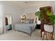 Stylish bedroom with queen-sized bed, vintage accents, and ample natural light at 3777 Peachtree Ne Rd # 1227, Brookhaven, GA 30319
