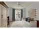 Bright bedroom with decorative rug, daybed, ceiling fan, and storage cabinet at 3777 Peachtree Ne Rd # 1227, Brookhaven, GA 30319